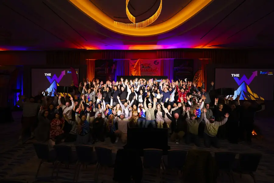 The whole company with hands up at Camp Forward '26