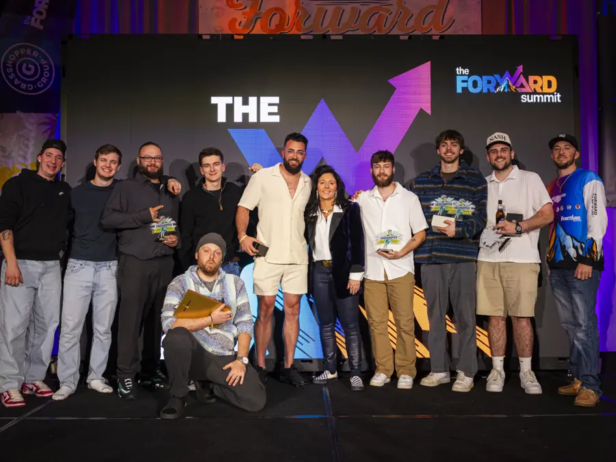 Amanda with award winners on stage under the W at Camp Forward '26